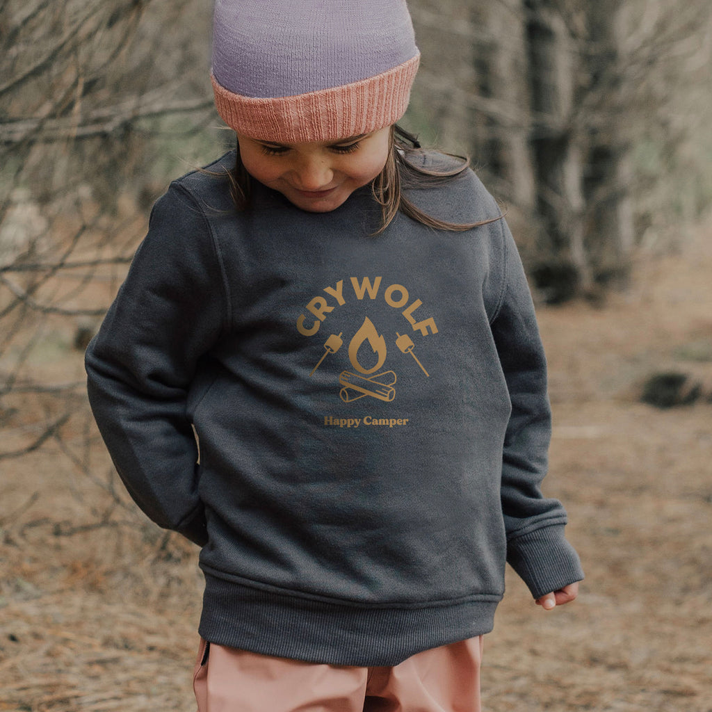 A small girl wearing a Crywolf organic sweater